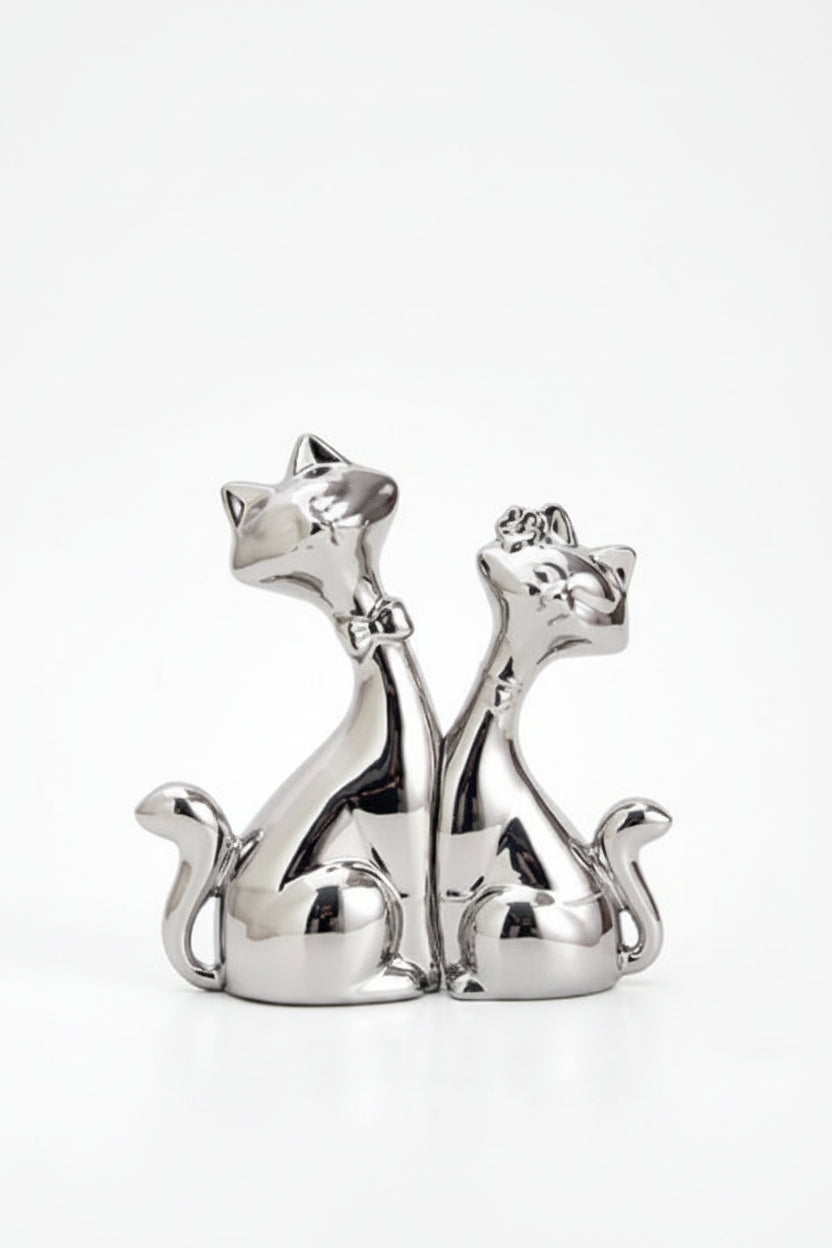 A pair of silver ceramic cat ornaments shaped like a gentleman and lady, shown on a plain white background with text detailing the dimensions.