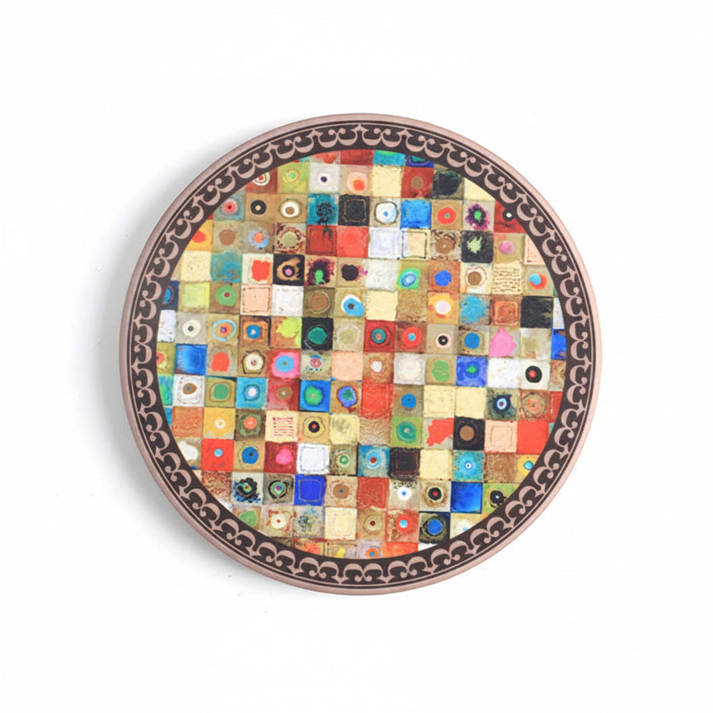 Round decorative plate with a mosaic pattern on a white background