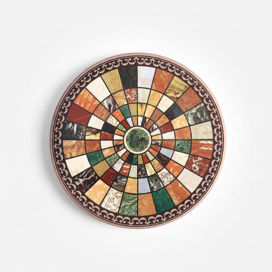 Decorative round plate with multicolored mosaic design on a white background