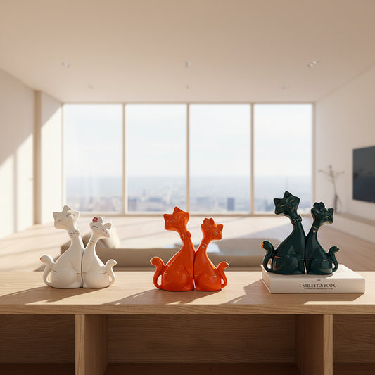 Collection of colorful cat-shaped decorative items on a shelf.